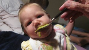 Akaisha trying peas for the first time.